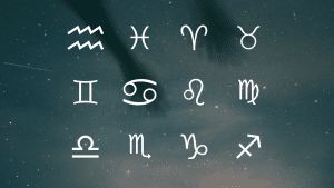 Twelve white zodiac symbols displayed against a dark, starry night sky background with faint cloud and shadow outlines