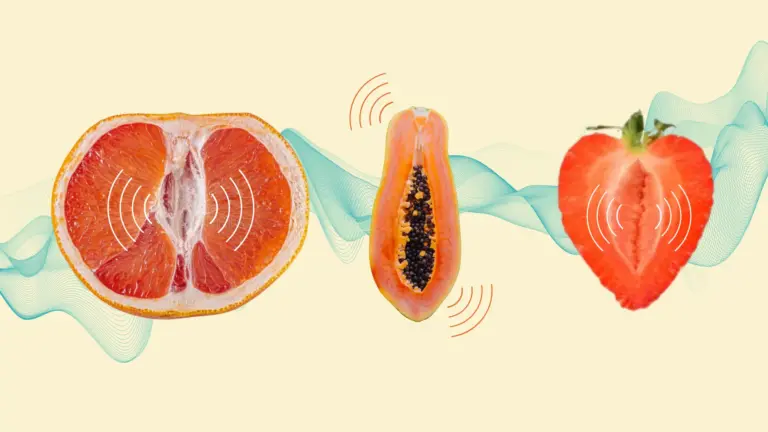 A halved grapefruit, papaya, and strawberry arranged horizontally against a pale yellow background with wave patterns symbolising throbbing