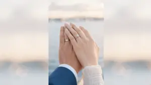 Couple showing rings, how long should you date before marriage moment captured naturally