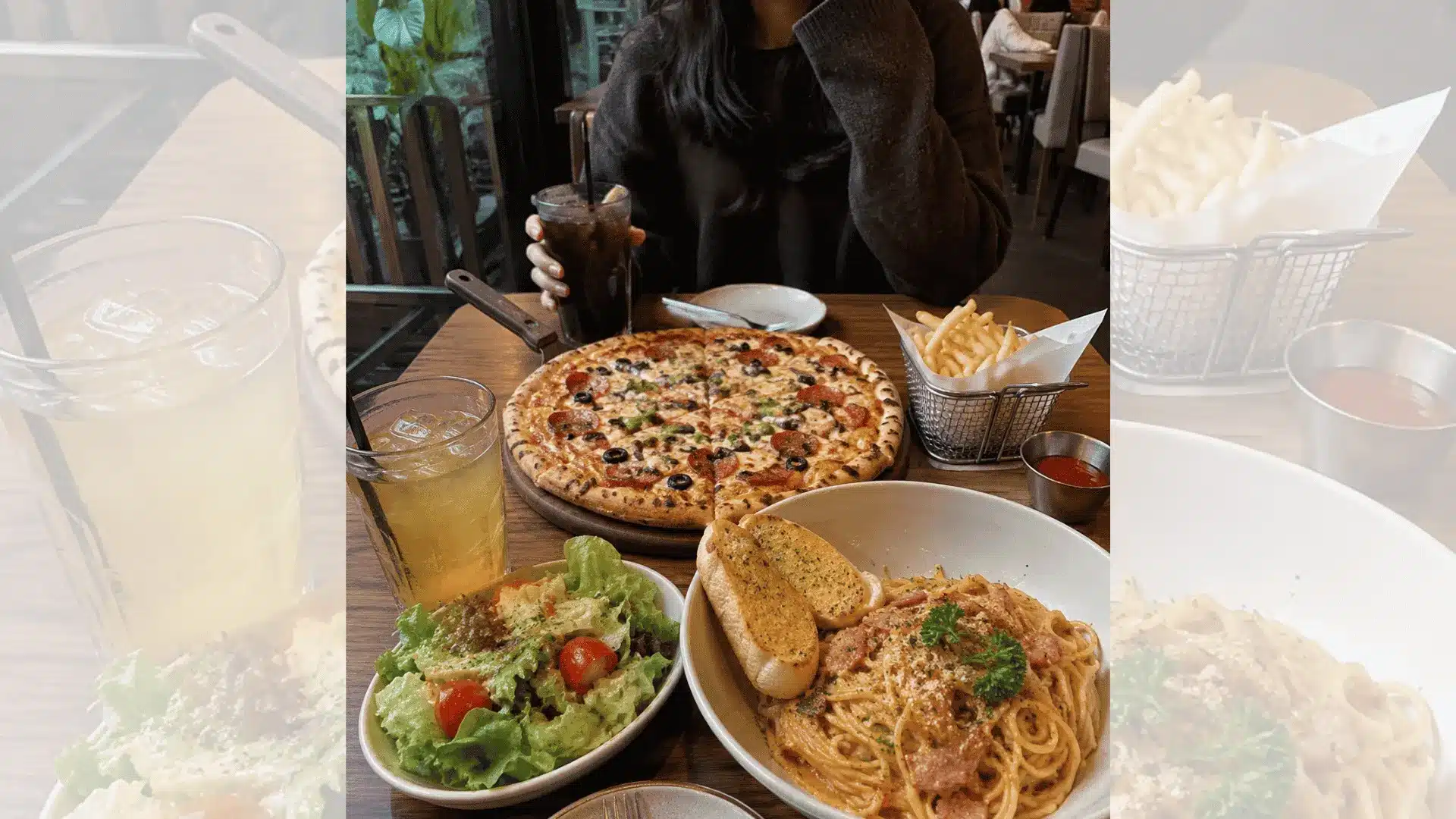 Casual restaurant date with pizza, pasta, fries, drinks, and cozy modern café atmosphere